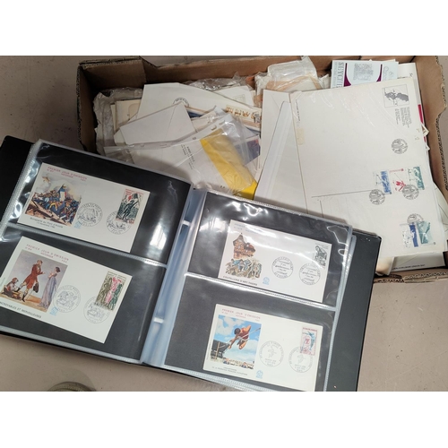 48 - An album of French FDC's and an unsorted selection of stamps