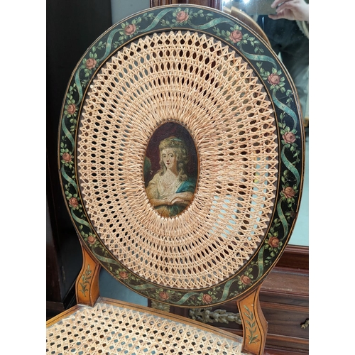 497 - An Adam style satinwood boudoir chair with an oval cane back and cane seat, with extensive painted f... 