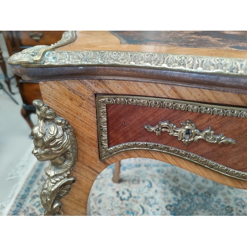 498 - A late 19th/early 20th century Louis XV style quarter veneered shaped rectangular bureau, flat with ... 