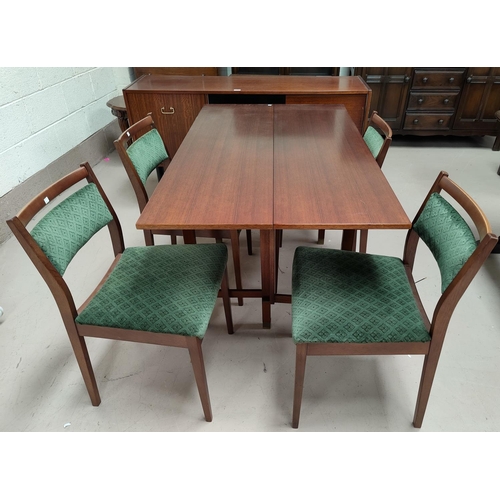 521 - A 1950's/60's G-Plan sapele dining suite comprising rectangular side extending table, length 138 cm,... 