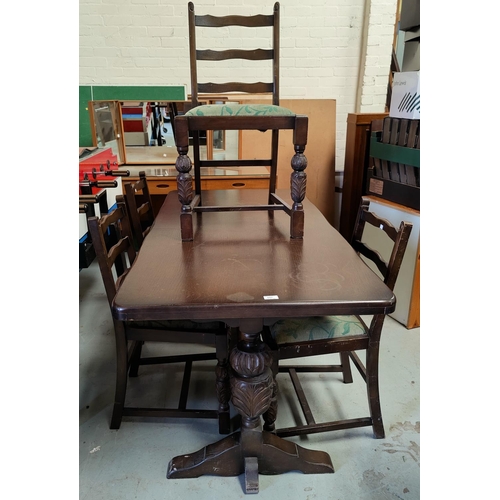 527 - A Jacobean style oak dining suite comprising rectangular table and 4 ladder back chairs