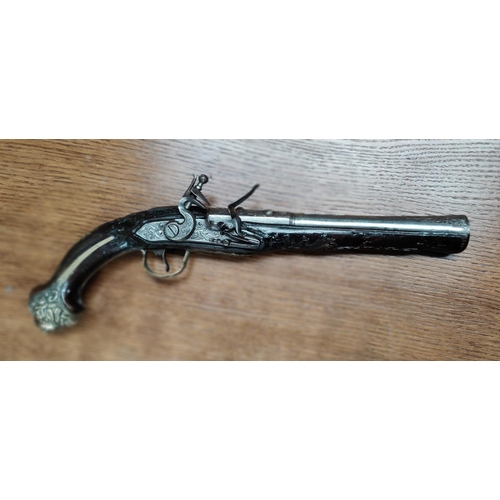 82 - A late 18th/early 19th century Ottoman blunderbuss pistol with extensive  chased relief decoration t... 