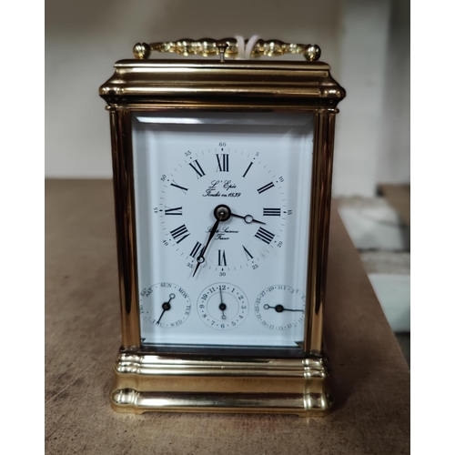 85 - A reproduction brass carriage clock with repeating/striking movement, white enamel dial with 3 subsi... 