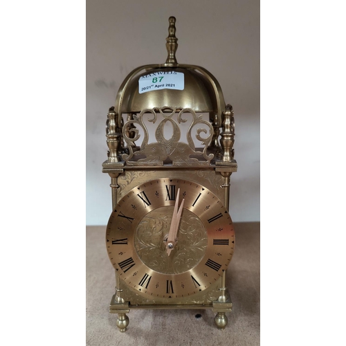 87 - A reproduction lantern clocks with mechanical movement, height 29 cm