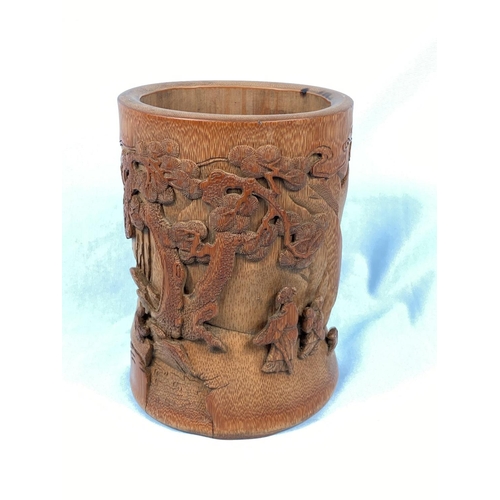 157 - A Chinese carved bamboo brush pot with traditional scenes in relief