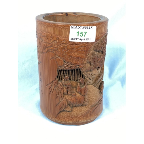 157 - A Chinese carved bamboo brush pot with traditional scenes in relief