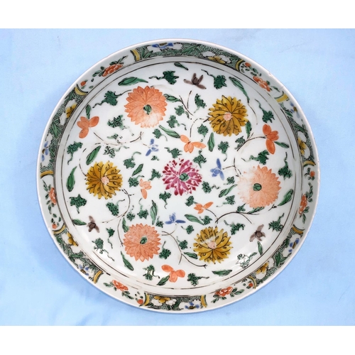 186 - A Chinese Kangxi period dish decorated with various flowers, with border to the edge 27cm in diamete... 