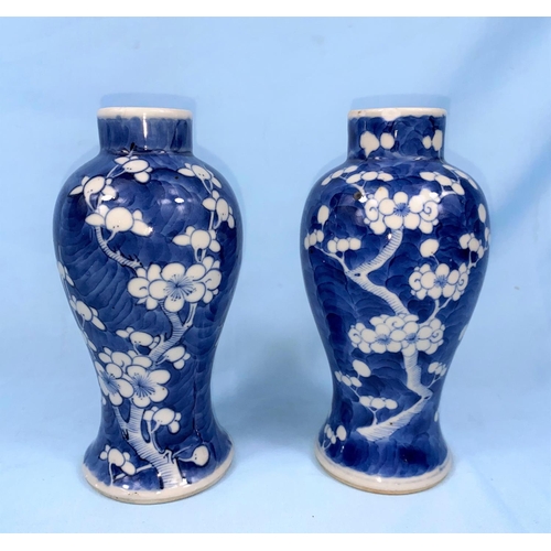 190 - A near-matching pair of Chinese blue and white baluster vases. With prunus blossom decoration. 4 cha... 