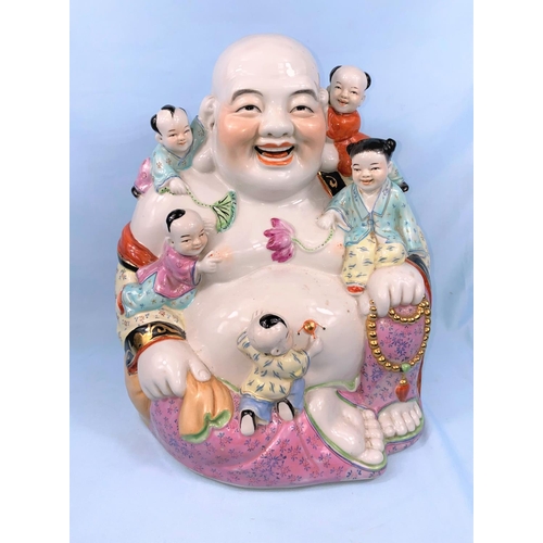 262 - A large Chinese modern figure of seated budha with children climbing on him. Height 36cm (one child'... 