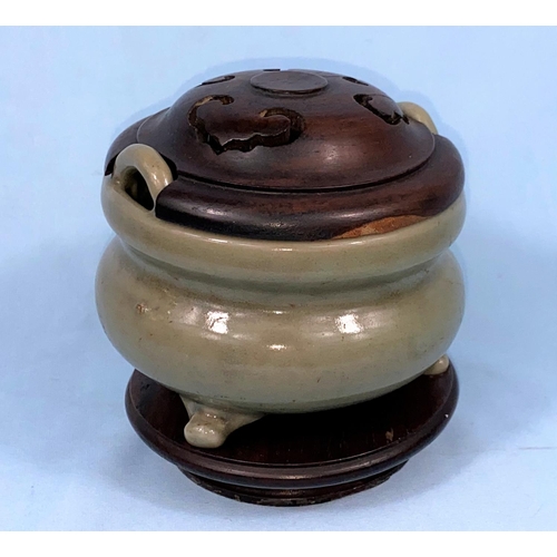 176 - A Chinese celedon glaze tripod censor with carved wooden cover fitted over two handles height 10.5cm