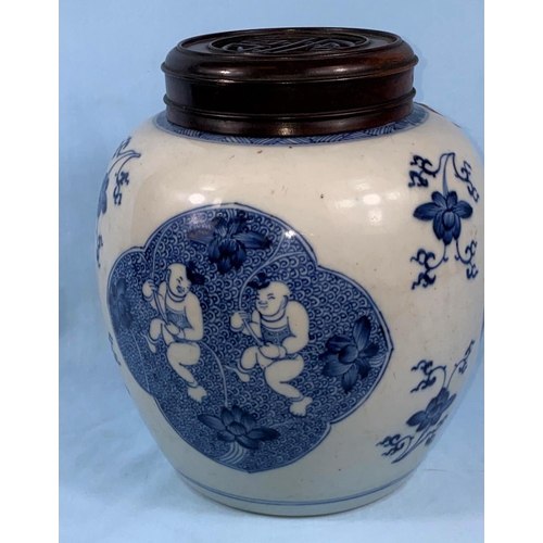 179 - A large Chinese blue and white ginger jar with carved and pierced wooden lid, the body of the jar ha... 