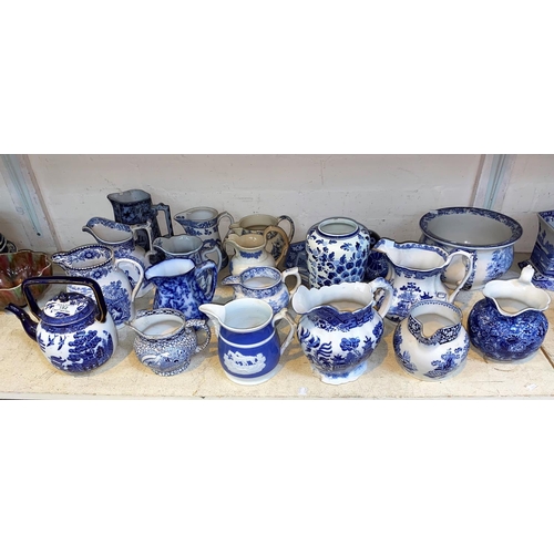 182 - A selection of blue and white china, jugs, tea pots etc