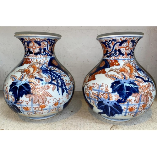 269 - 2 imari bulbous vases of squat form with flared neck, decorated with phoenix etc. Height 23cm