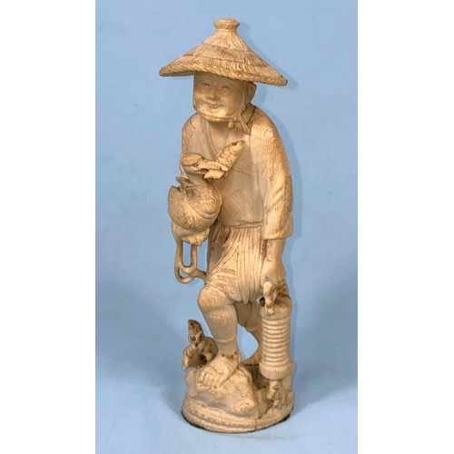 61 - An early 20th century Japanese okimono ivory figure if a a fisherman with cormorant and net, red sea... 