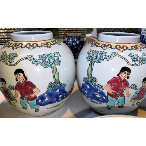 235 - A 20th century Chinese pair of ginger jars decorated in polychrome with children, printed seal mark ... 