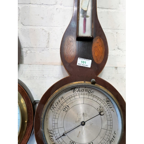 101 - An Edwardian aneroid barometer with thermometer, in Sheraton style inlaid mahogany banjo shaped case... 