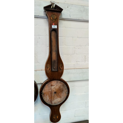 103 - A 19th century mercury column barometer with thermometer in banjo shaped mahogany case, by Webb, Hox... 