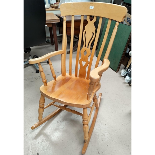 495 - A modern light wood fiddleback rocking chair, three modern country style kitchen chairs