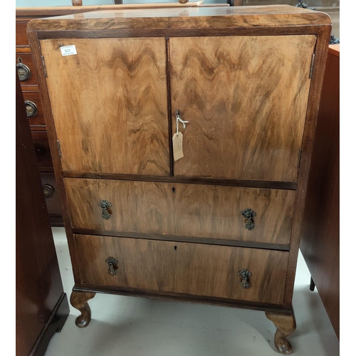 531 - A 1930's figured walnut gent's tallboy with double cupboard and 2 drawers