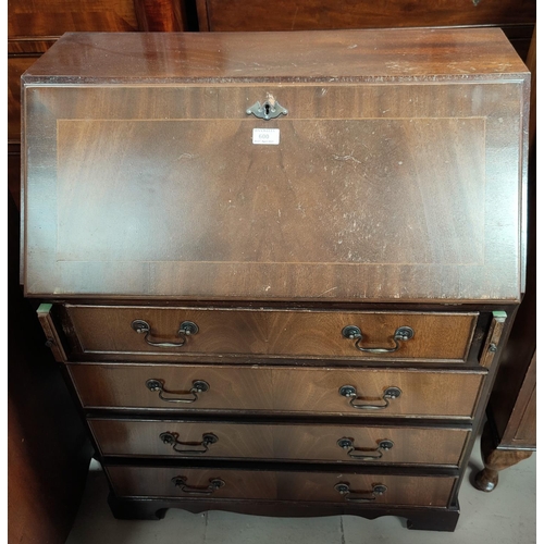 600 - A reproduction mahogany fall front bureau with 4 drawers