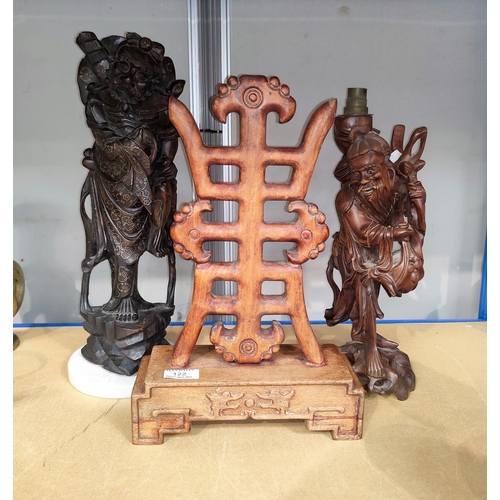 122 - A Chinese carved hardwood character on stand, height 40cm. 2 carved Chinese wooden figures, one inla... 
