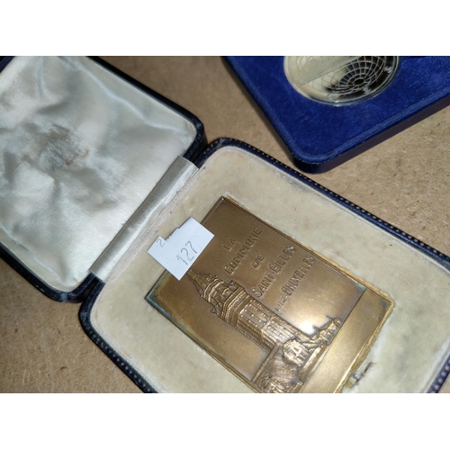127 - A cased brass commemorative plaque - La Commune De Saint-Gilles Lez Bruxelles, a cased medallion for... 