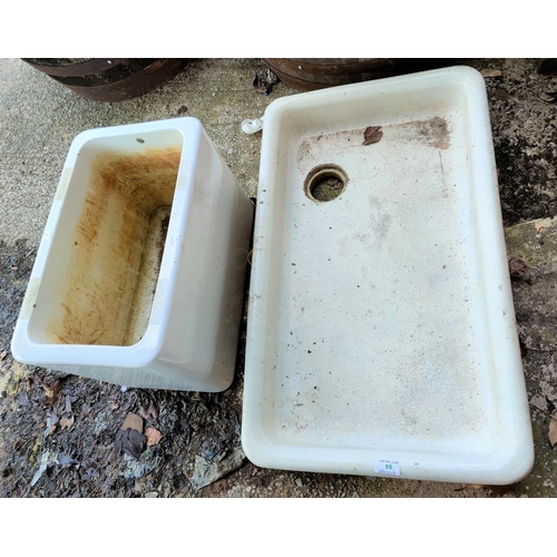 84 - An early 20th century glazed sink and a similar cistern