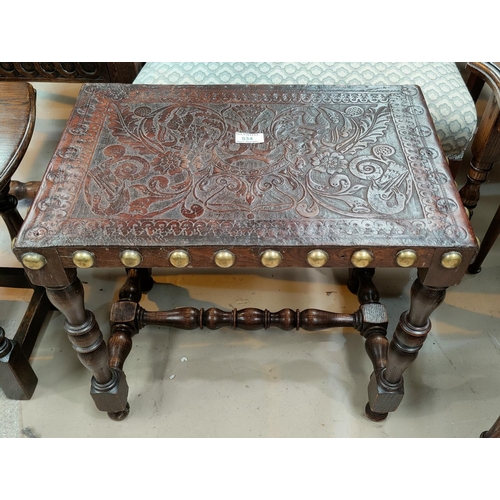 534 - A rectangular oak stool with studded Portuguese leatherwork top.