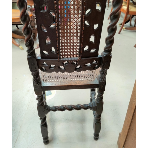653 - A Carolinian style chair with barley twist supports, with old metal fixes, bergere and heavily carve... 