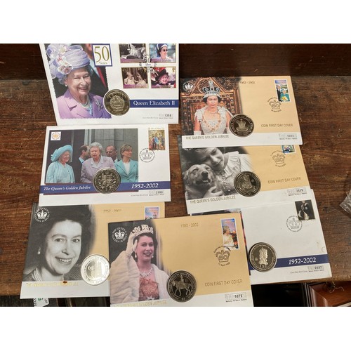 153 - Seven QEII Golden jubilee and Commonwealth coin / stamp covers to include GB £5 and Guernsey £5