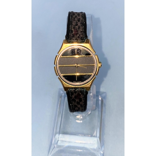 412 - An originally cased lady's Yves Saint Laurent Collection wristwatch on original woven strap, gilt ca... 