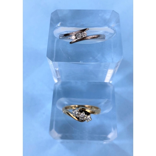 417 - A 9 carat gold ring set 3 small diamonds and another 9 carat white gold ring set with 3 small diamon... 