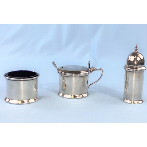 504 - A three piece hallmarked silver cruet set with blue glass liner, salt, pepper and mustard Birmingham... 