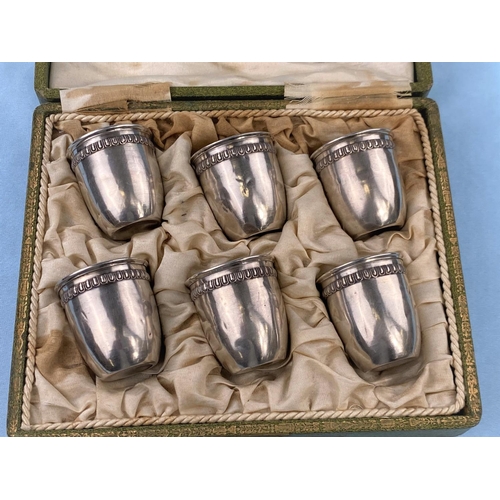 515 - A cased set  of 6 French white metal tot cups with tongue and dart borders, 1.7oz.