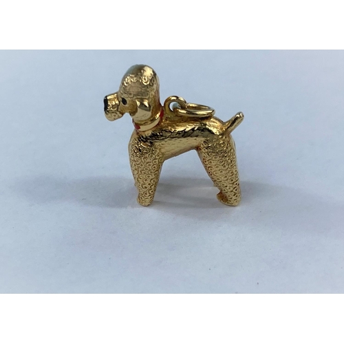 516 - A yellow metal charm in the form of a poodle, (unmarked, tests as 18ct, 2.7gm)