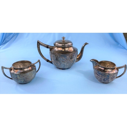 517 - A Japanese white metal 3 piece tea set decorated with bamboo against an orange peel ground, stamped ... 