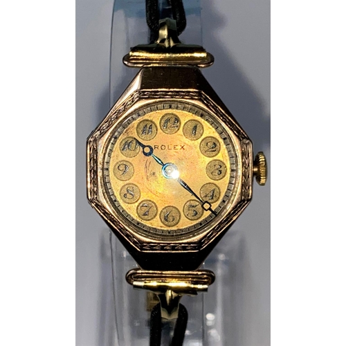 423 - A 1920's lady's Rolex dress watch in 9 carat gold octagonal case with 7 jewelled movement, gilt face... 