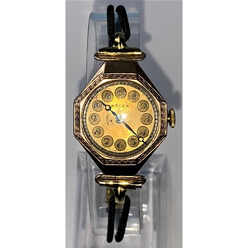 423 - A 1920's lady's Rolex dress watch in 9 carat gold octagonal case with 7 jewelled movement, gilt face... 