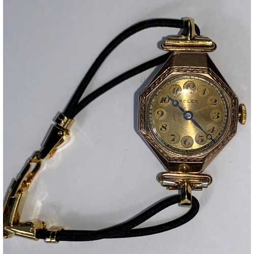 423 - A 1920's lady's Rolex dress watch in 9 carat gold octagonal case with 7 jewelled movement, gilt face... 