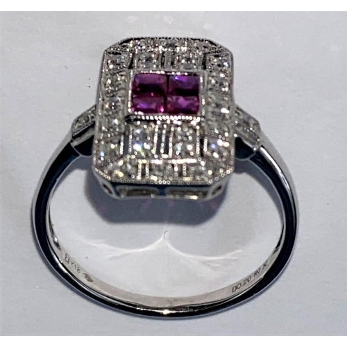 439 - An Art Deco style white metal ruby & diamond ring, comprising of 4 baguette cut rubies surrounded by... 