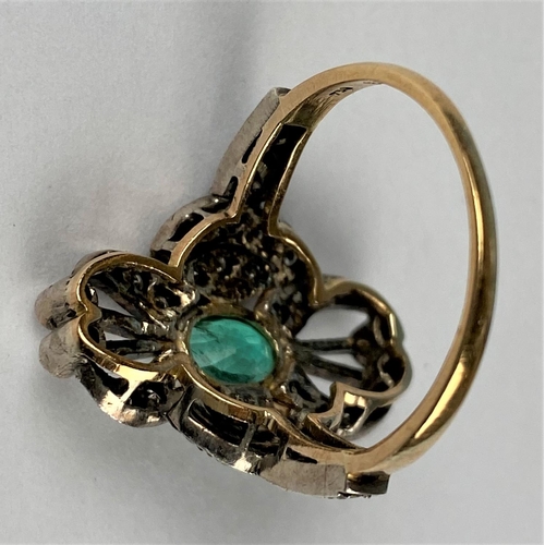 441 - An early 20th century emerald & diamond ring comprising of a central oval emerald with 38 diamonds i... 