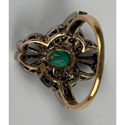 441 - An early 20th century emerald & diamond ring comprising of a central oval emerald with 38 diamonds i... 