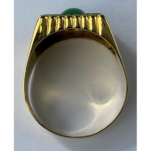 475 - A yellow metal gent's signet ring set with square jet coloured base with central jade coloured domed... 