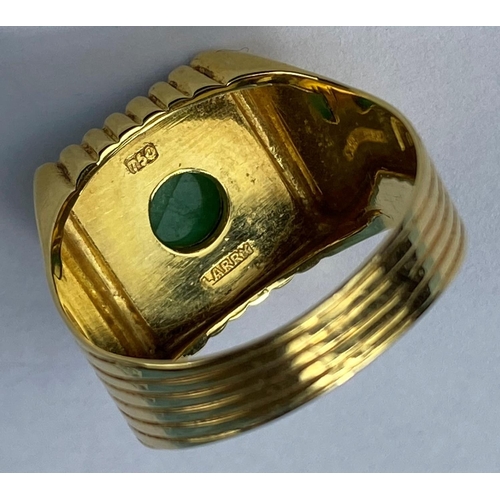 475 - A yellow metal gent's signet ring set with square jet coloured base with central jade coloured domed... 