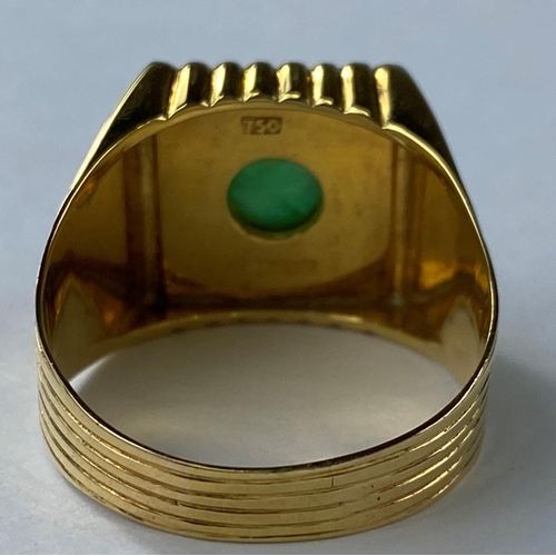 475 - A yellow metal gent's signet ring set with square jet coloured base with central jade coloured domed... 