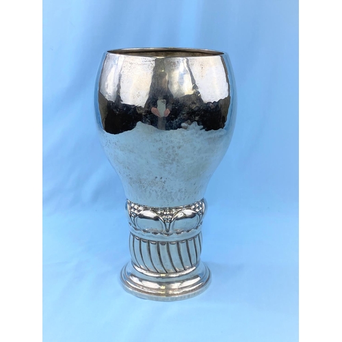 519 - A planished Swedish silver goblet shaped vase on naturalistic column and stepped foot, 20.5cm high, ... 