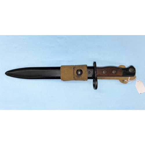 179 - A BRITISH no5 Mk1 pattern Jungle carbine bayonet and scabbard, the blade etched STERLING but otherwi... 