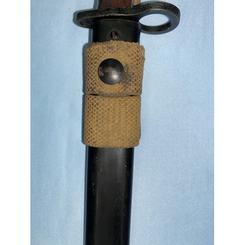 179 - A BRITISH no5 Mk1 pattern Jungle carbine bayonet and scabbard, the blade etched STERLING but otherwi... 