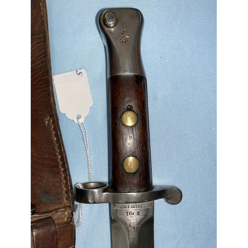 180 - A British Wilkinson 1888 Pattern Lee Metford bayonet and scabbard, the blade stamped double R, W.D. ... 