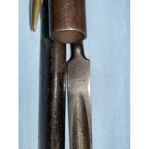 181 - A BRITISH 19th century socket bayonet and brass mounted leather scabbard, probably for an Enfield mu... 